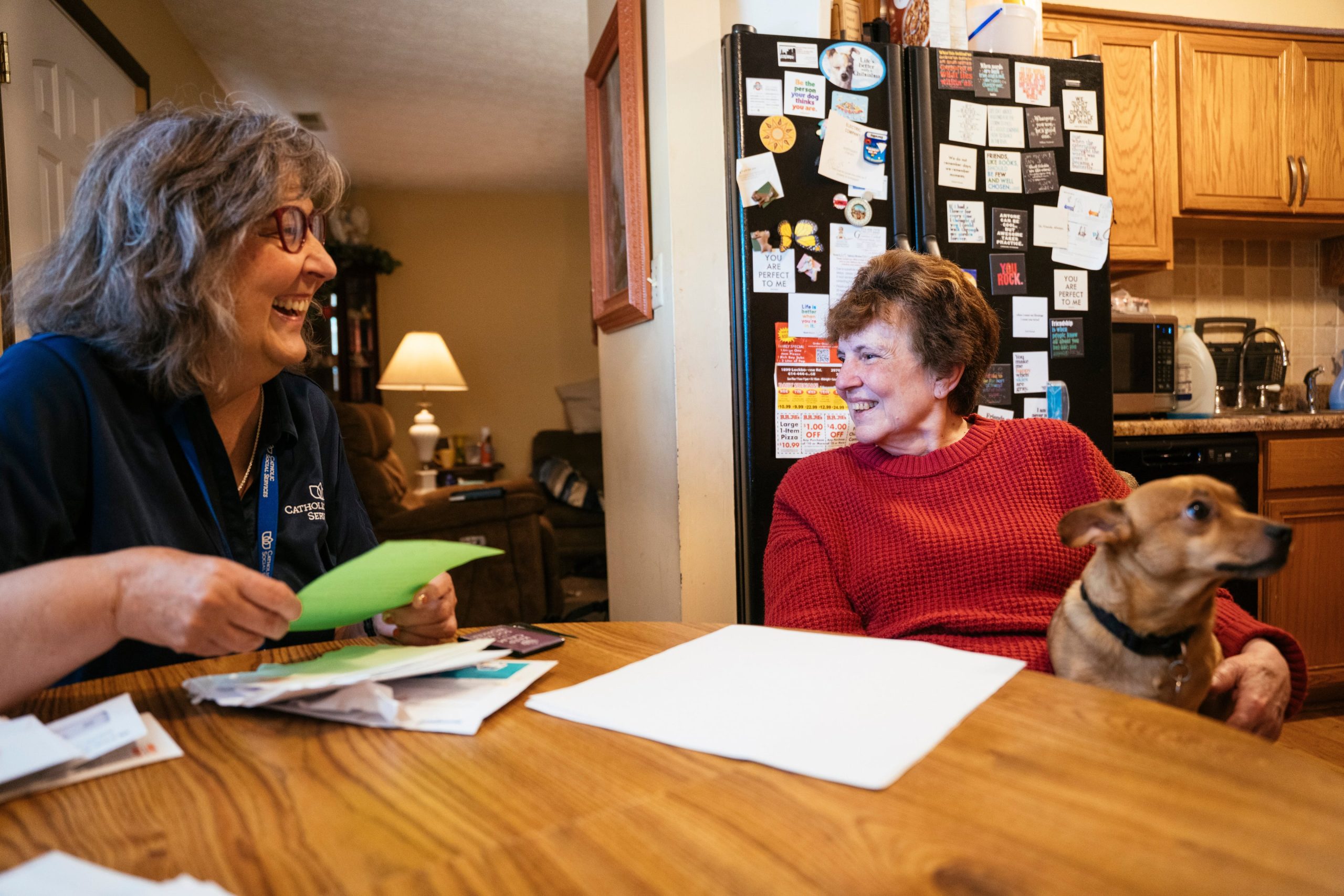 Senior companion volunteer spending time with an older adult